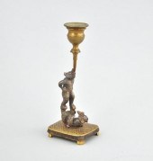 A Whimsical Figural Candlehold