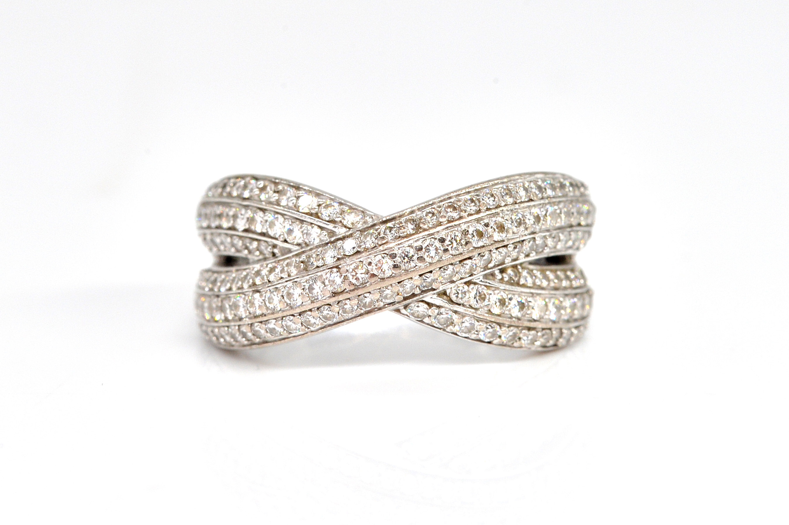 A WHITE GOLD AND DIAMOND CROSS OVER