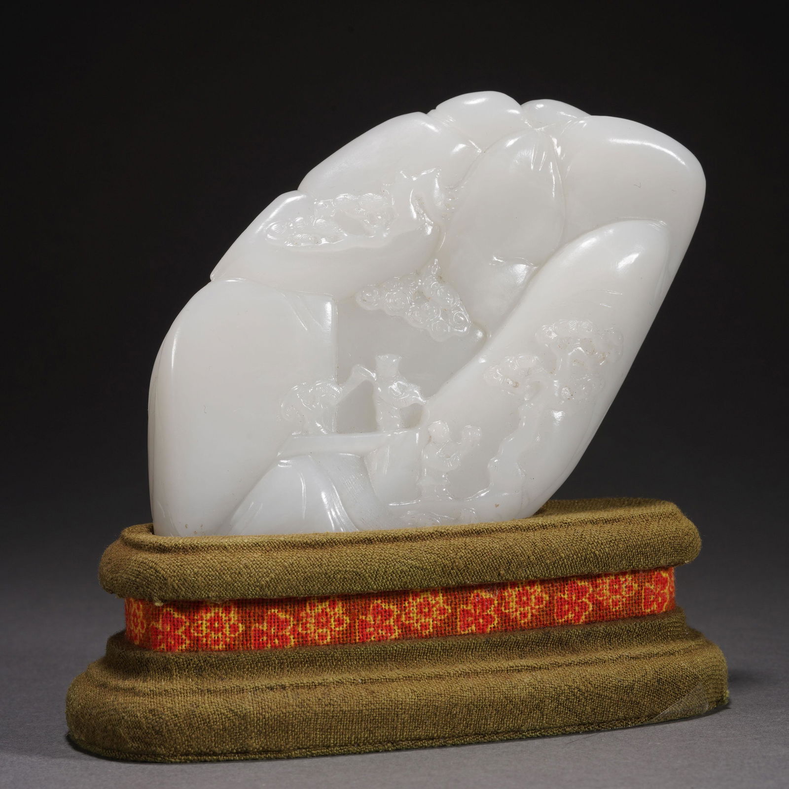 A WHITE JADE CARVED FIGURE STORY