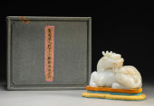 A WHITE JADE QILIN FIGURE<br>A