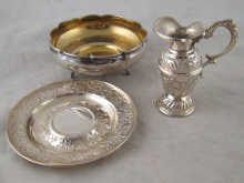 A white metal bowl marked 800AG a