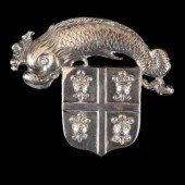 A white metal livery badge, 19