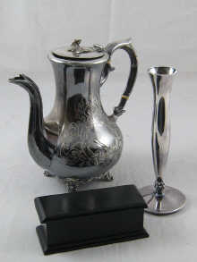 A white metal (marked 925) bud vase