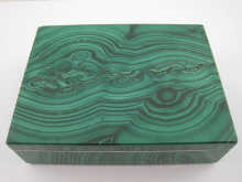 A white metal mounted malachite