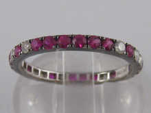 A white metal (tests gold) ruby and