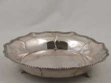 A white metal (tests silver) deep
