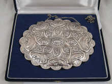 A white metal (tests silver) backed