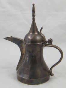 A white metal (tests silver) coffee