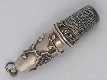A white metal (tests silver) sewing