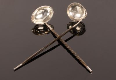 A white metal toddy ladle,