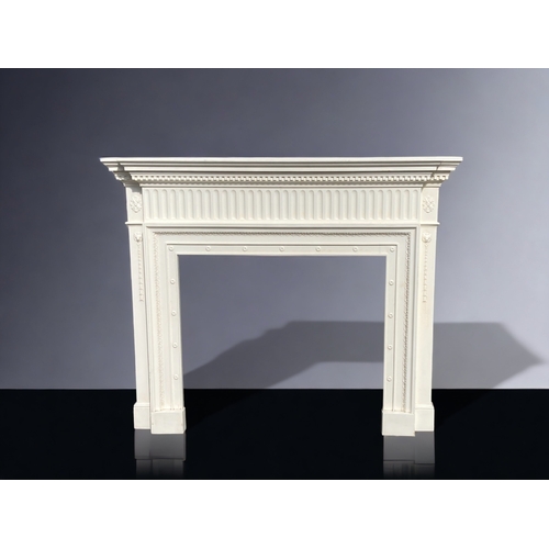 A WHITE MOULDED FIBREGLASS FIRE