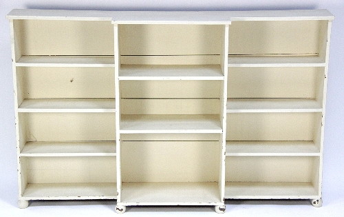 A white painted breakfront bookcase