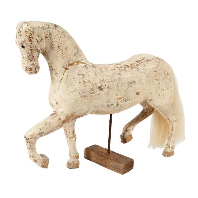 A white painted carved wooden