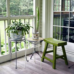 A white painted iron plant stand,