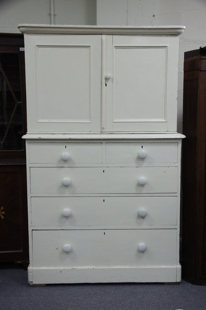 A white painted pine cupboard