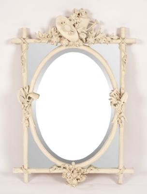 A white painted segmented mirror,