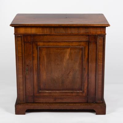 A William IV cupboard enclosed by a