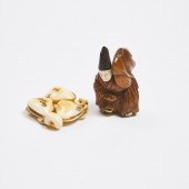 A Wood and Ivory Netsuke of a