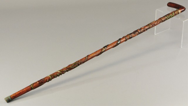 a/ WOOD CARVED CANE Extensive