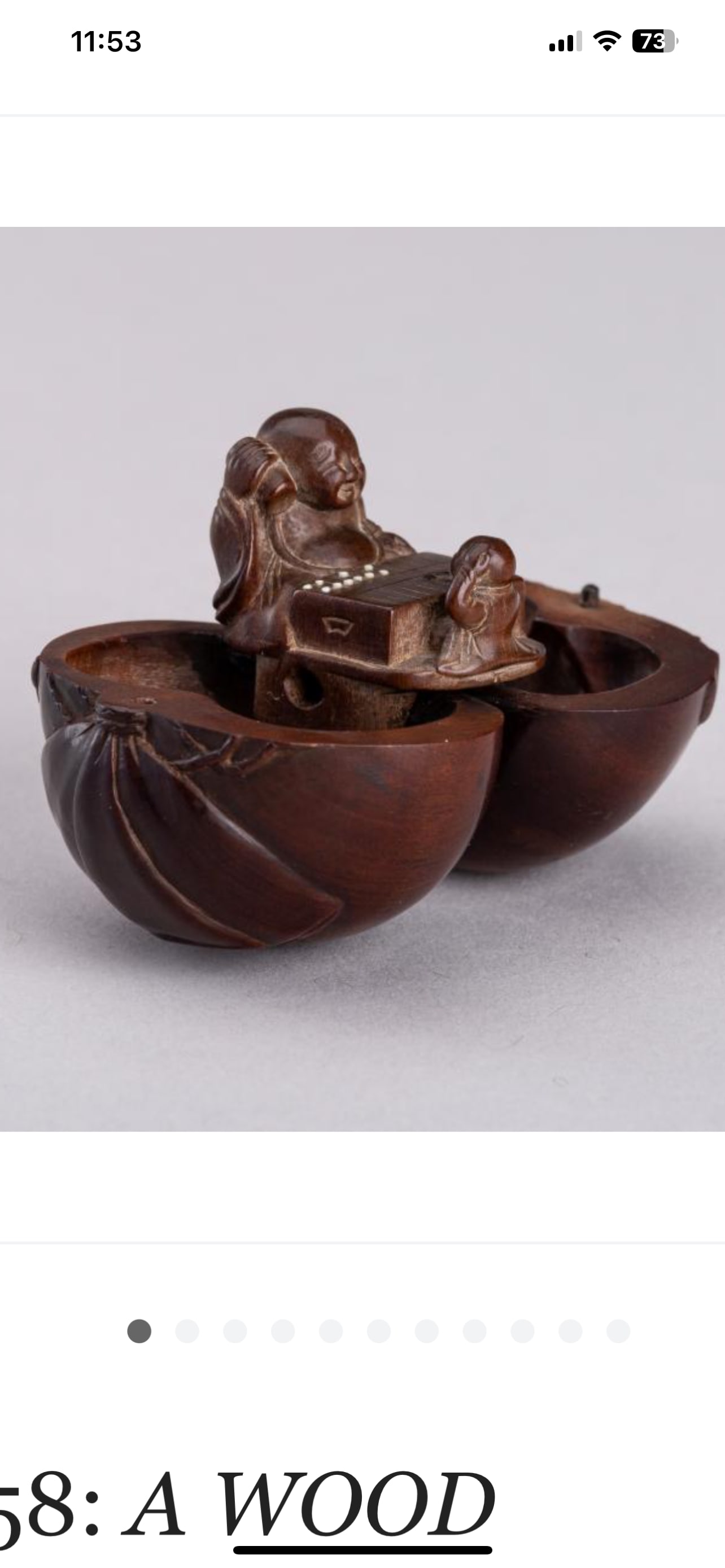 A WOOD KARAKURI NETSUKE WITH A