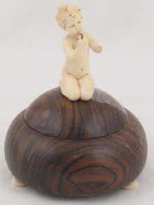 A wooden Art Deco powder box on