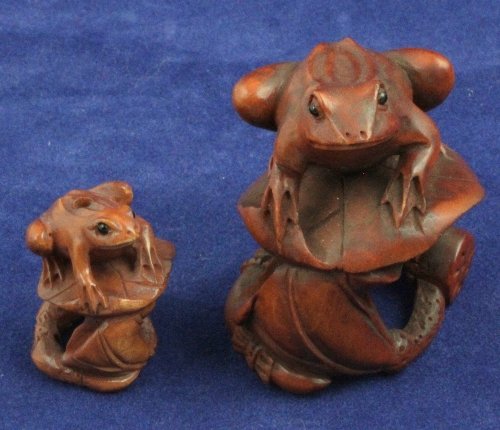 A wooden netsuke signed in the form