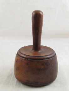 A wooden stone or wood carver's