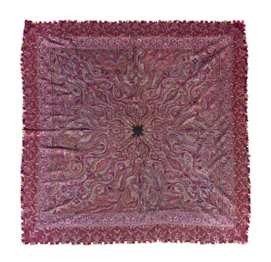 A Woven Paisley Shawl having a