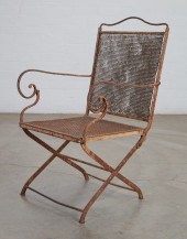 A WROUGHT IRON AND MESH FOLDIN