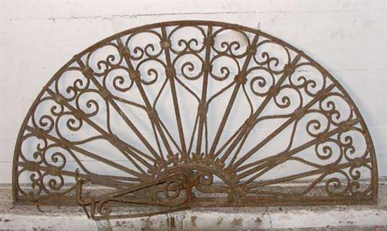 A Wrought Iron Arched Transom Grill