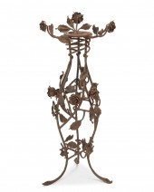A WROUGHT IRON FLORAL PLANT ST