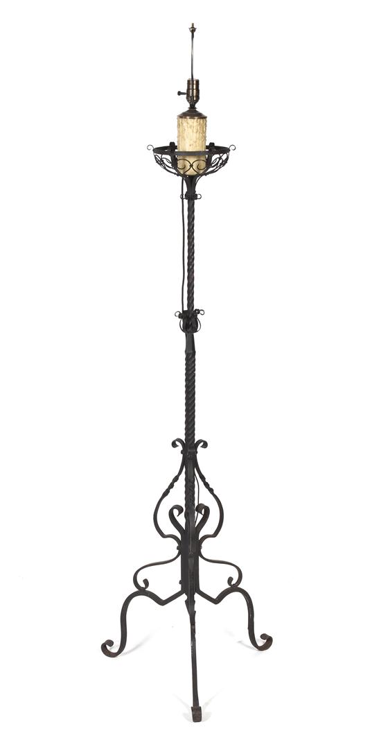 A Wrought Iron Torchiere having a