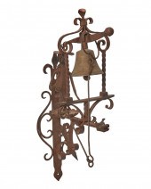 A WROUGHT IRON WALL-MOUNTED FI
