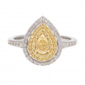 A YELLOW DIAMOND HALO RING IN