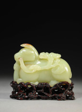 A YELLOW JADE CARVING OF DEER