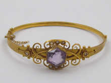 A yellow metal bangle (tests 9 ct