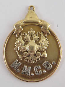 A yellow metal (tests 14 carat