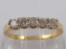 A yellow metal (tests 18 carat