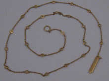 A yellow metal (tests 18 carat