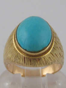 A yellow metal (tests 18 carat