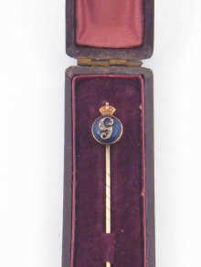A yellow metal (tests gold)