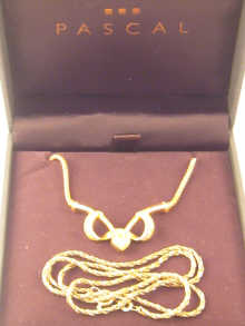 A yellow metal (tests high carat