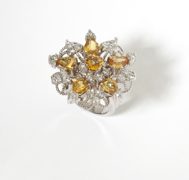 A yellow sapphire diamond and white