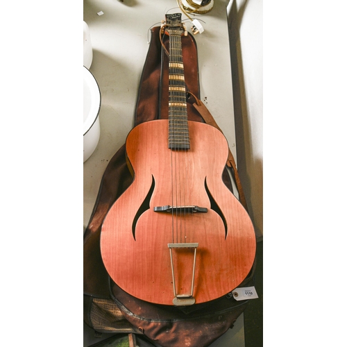A Zenith acoustic guitar, with soft