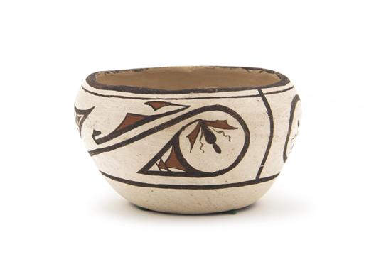 A Zuni Bowl having rain cloud and