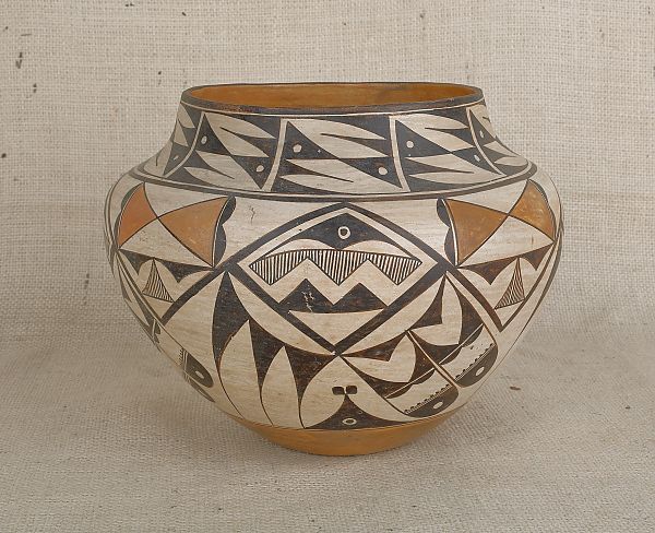 Acoma pottery olla with feather