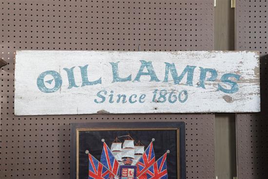 ADVERTISING SIGN. Painted wood sign