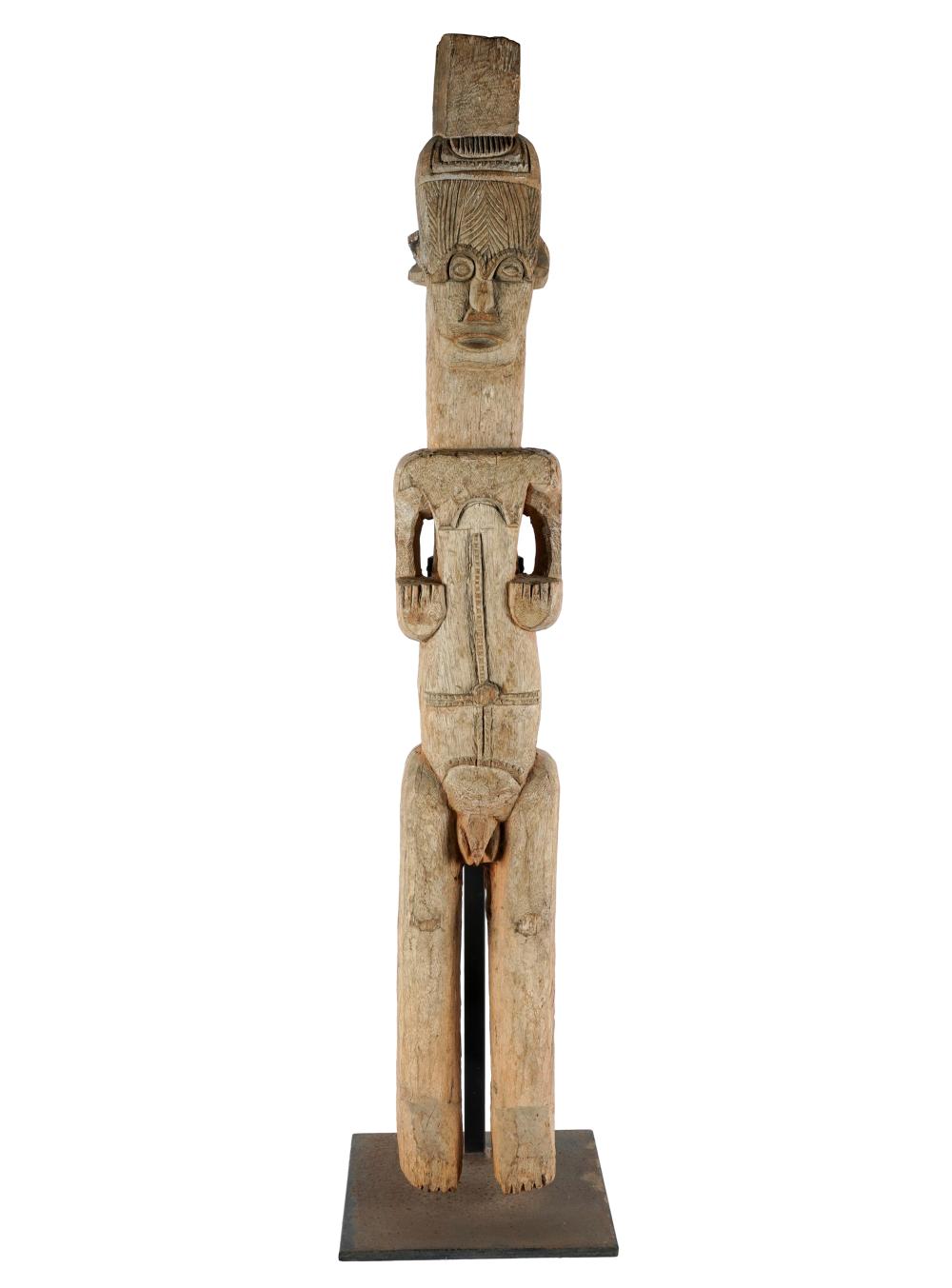 AFRICAN CARVED WOOD FIGUREon iron