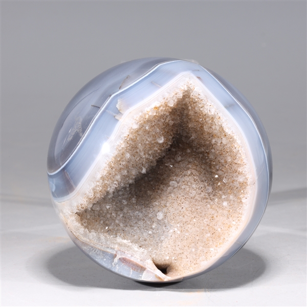 Agate sphere with druzy crystal