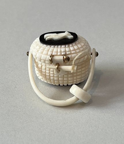 AL DOUCETTE CARVED BONE MINIATURE